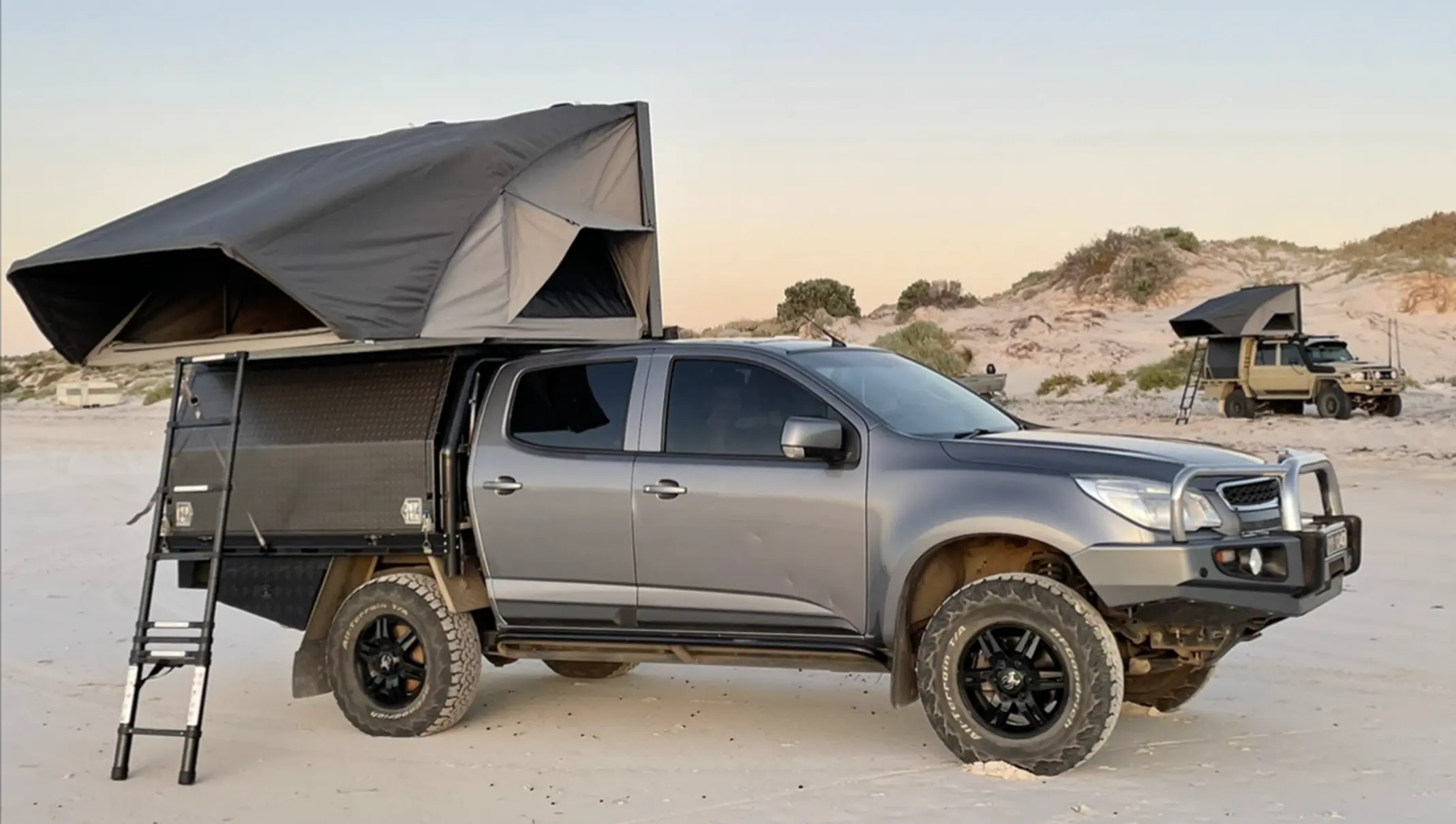 image of desert king camper with window extended